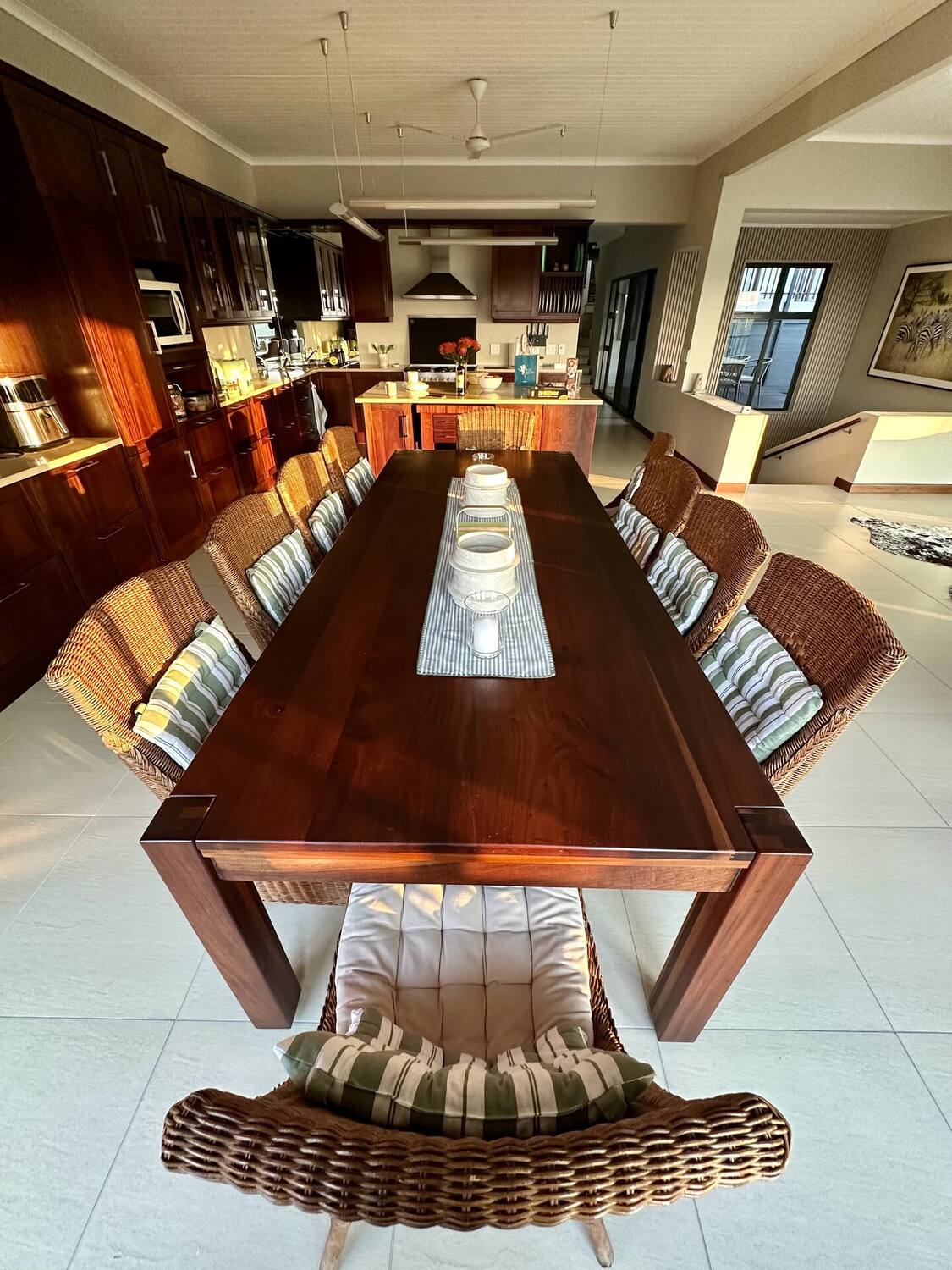 Fully equipped open-plan kitchen with large island and wine rack
