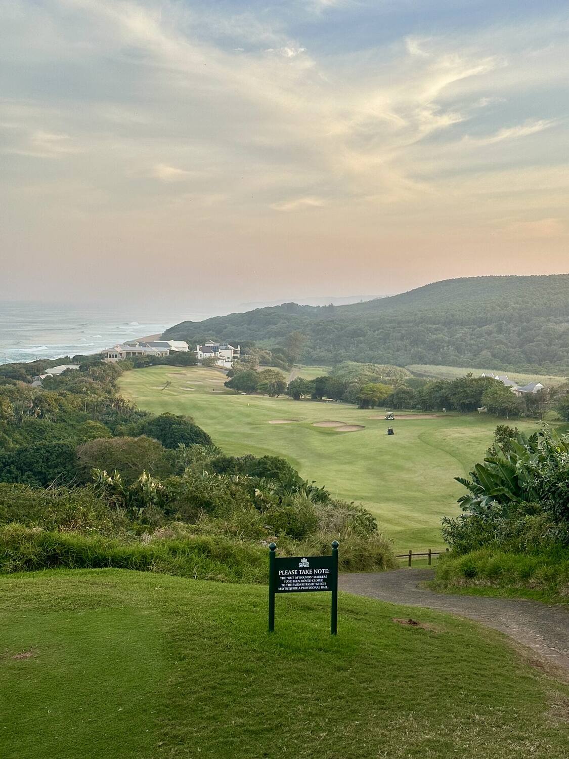 Glass-enclosed veranda at Fairway Views with views over the golf course