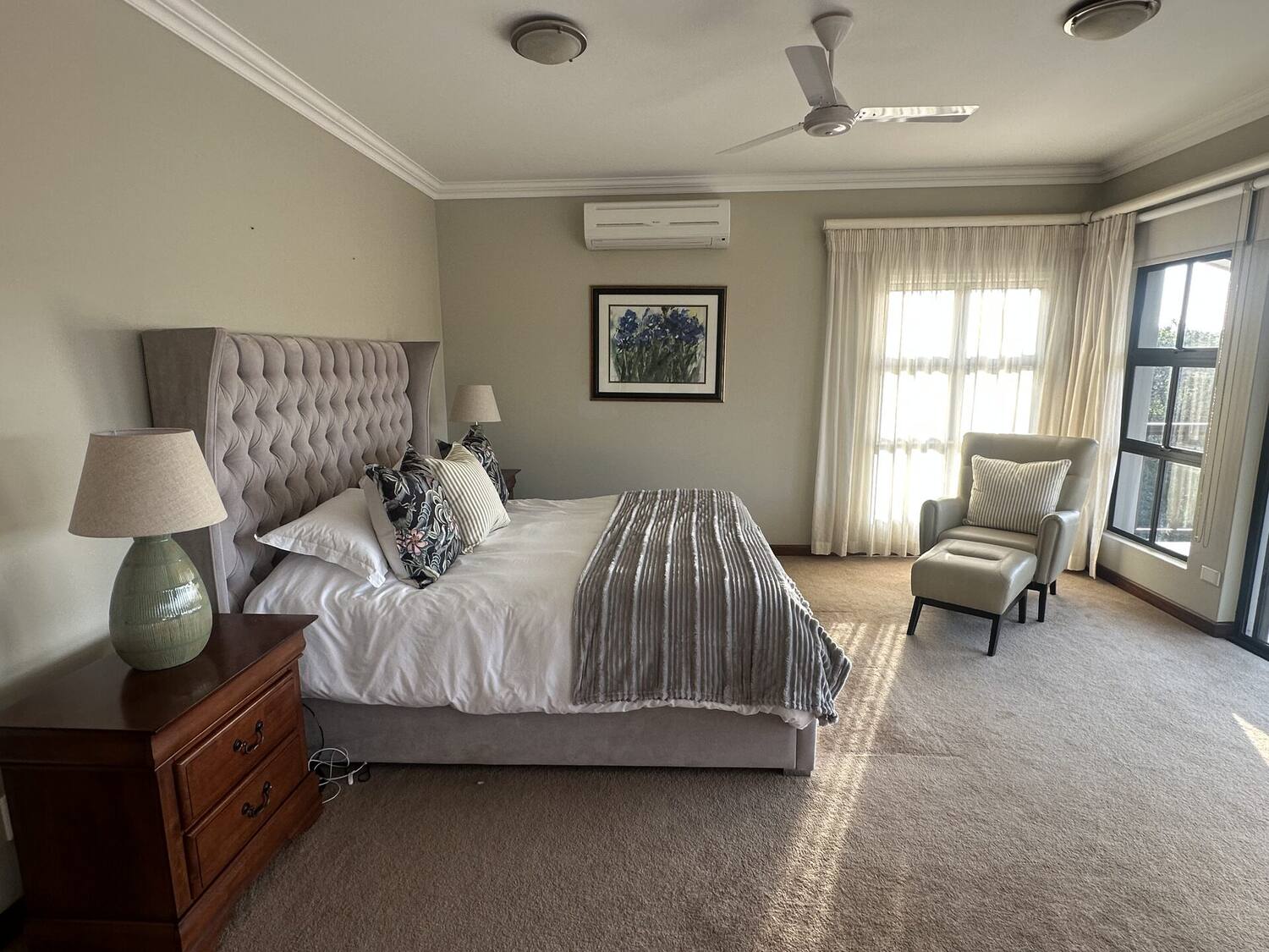 Master suite — king-size bed with tufted headboard