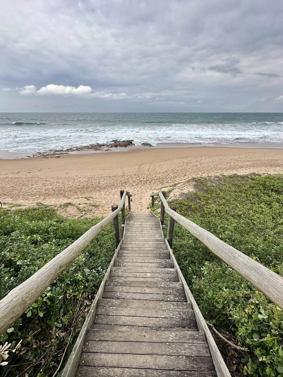 Private beach access — wooden boardwalk to the Indian Ocean