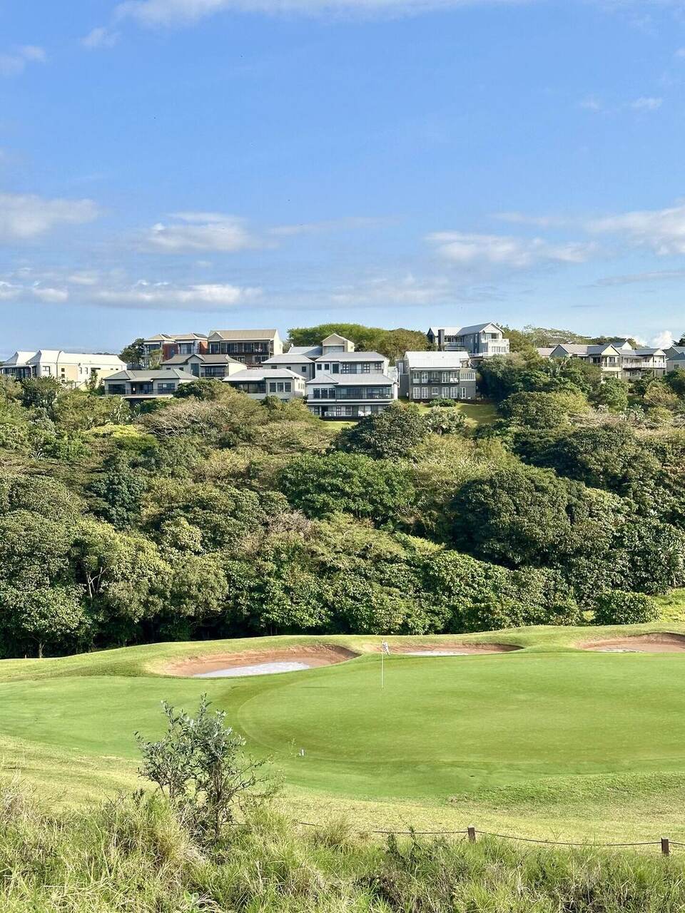 Golf course with estate villas on the hillside