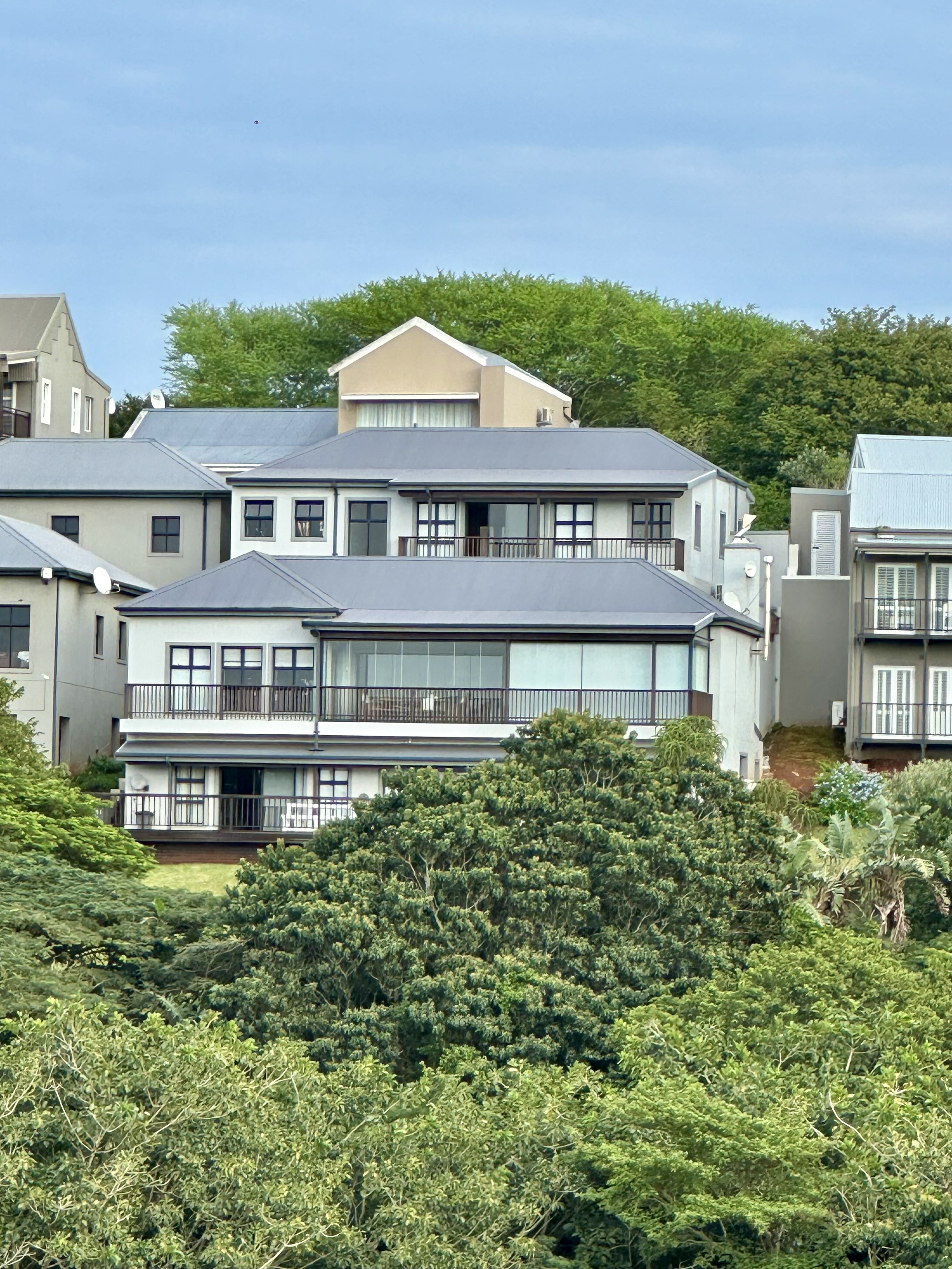 Fairway Views exterior rising above lush indigenous bush